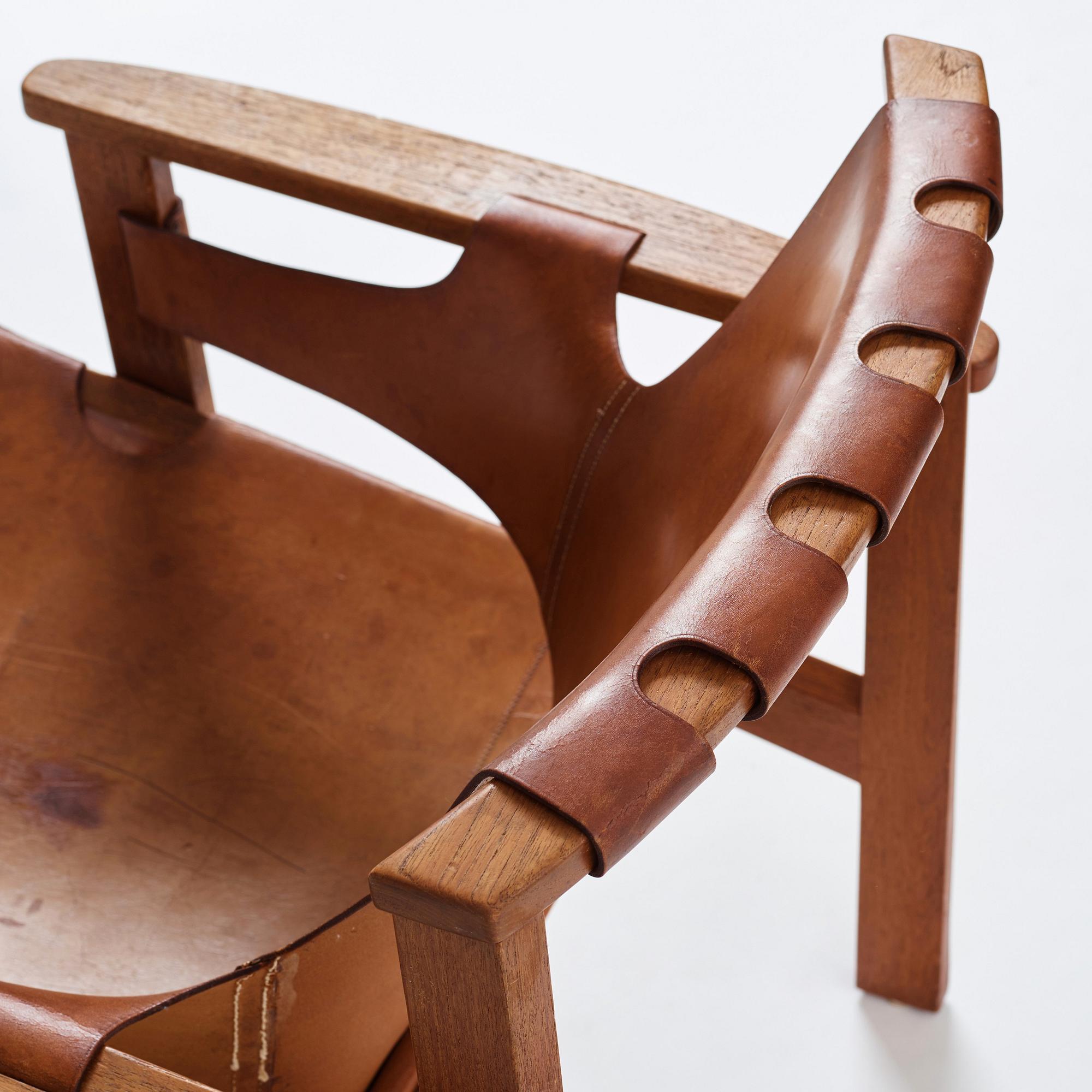 Carl-Axel Acking, a "Trienna" oak and natural leather easy chair, for Nordiska Kompaniet, Sweden 1960's.