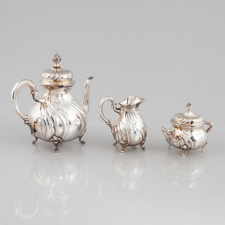 A German Silver Coffee Pot, Creamer and Sugar Bowl, mark of Wilhelm T Binder, Schwäbisch Gmünd, early 20th Century.