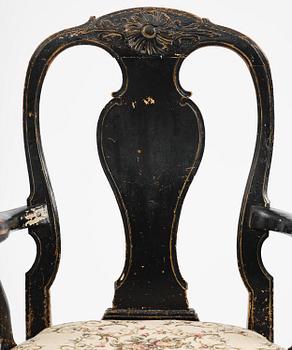 A pair of rococo armchairs in the manner of C. M. Sandberg, later part 18th century.