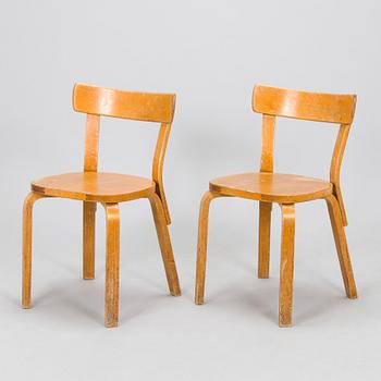 Alvar Aalto, a pair of mid-20th century model 69 chairs for O.Y. Huonekalu- ja Rakennustyötehdas A.B.