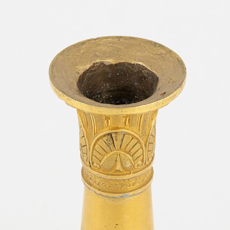 A bronze and porphyry candlestick, 20th Century.