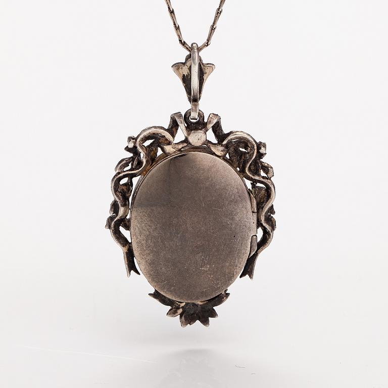 A necklace and a pair of earrings made of silver with enamel and marcasites. Paris, turn of the 20th century.