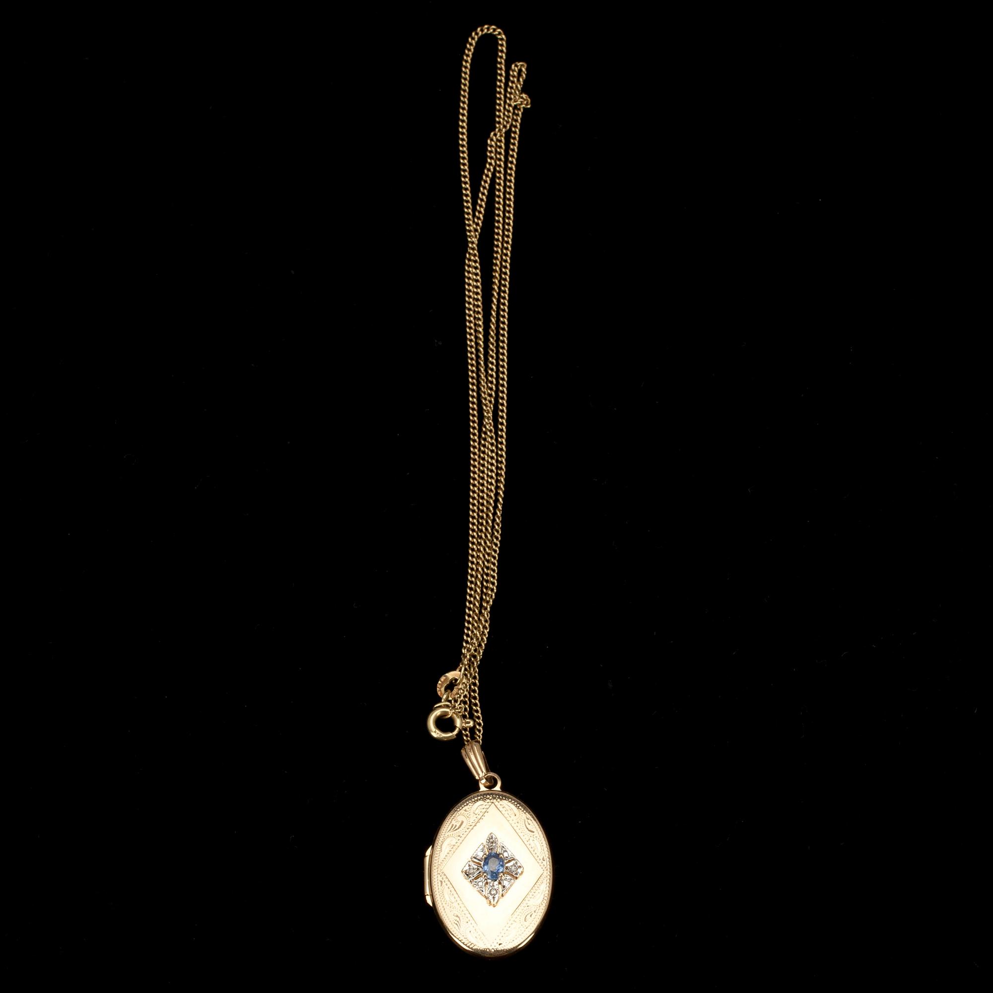 MEDALJONG / HÄNGSMYCKE, guld 14K, safir samt 4 små diamanter. Vikt 6,7 g.