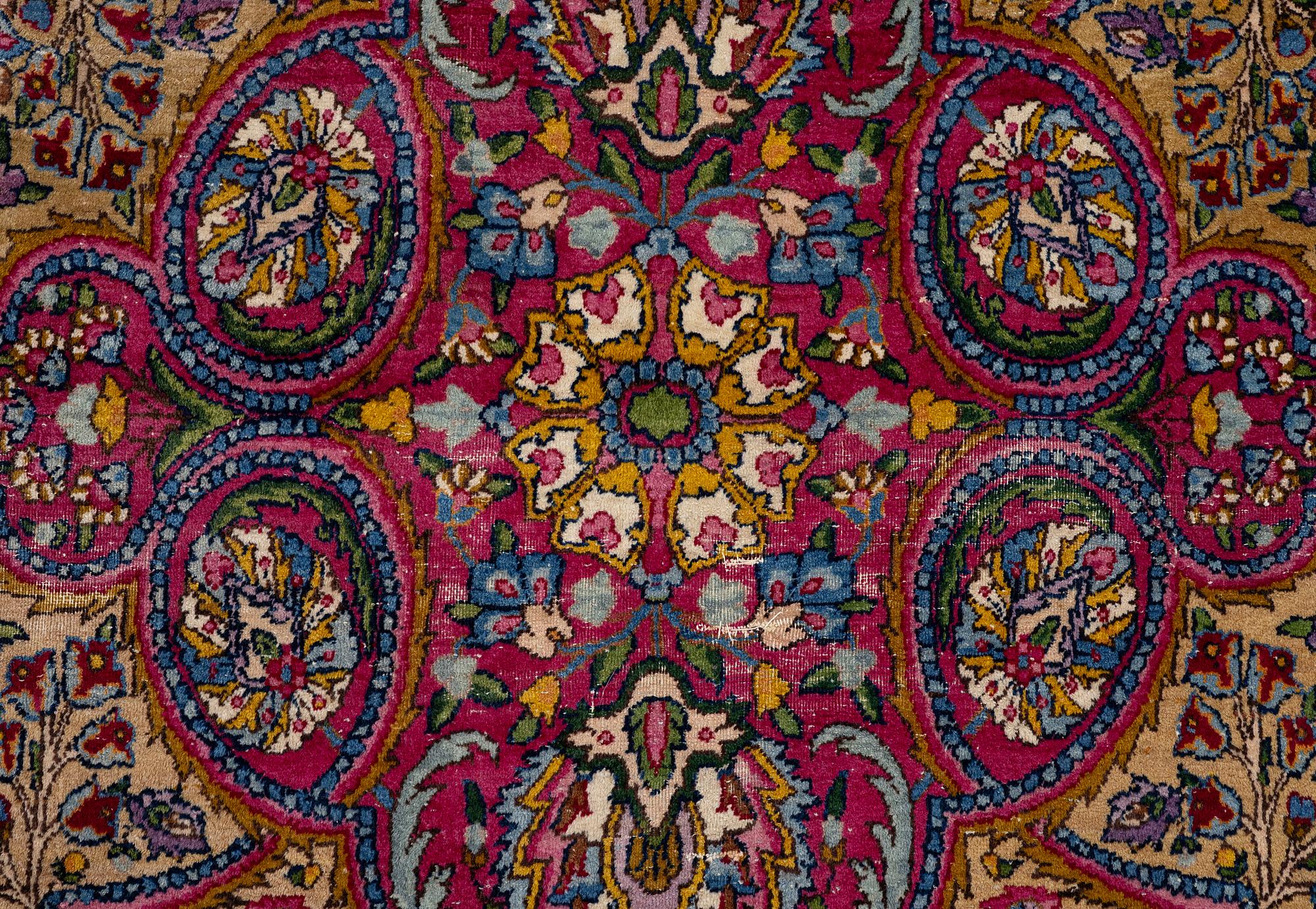A semi-antique Kirman carpet, south Persia, c. 440 x 279 cm.