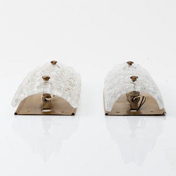 Carl Fagerlund, two brass and glass wall lights, Orrefors, later part of the 20th Century.