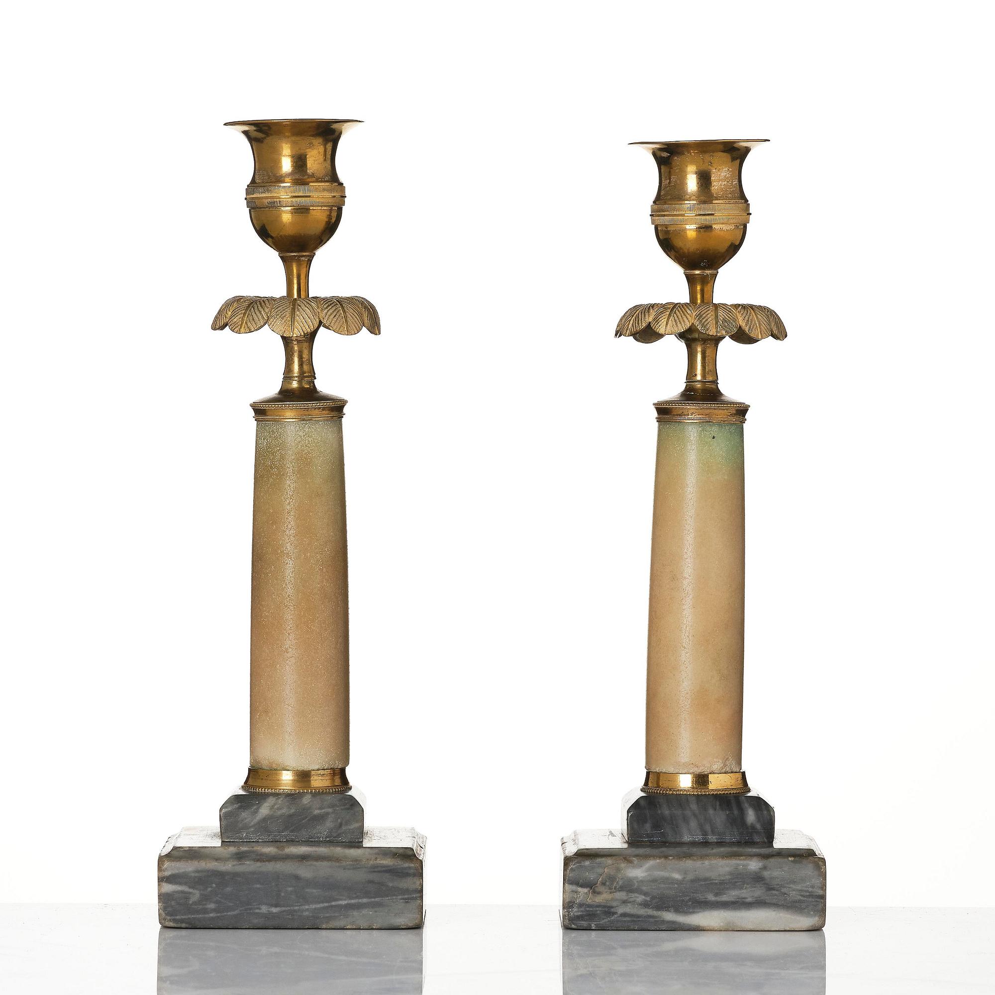 A pair of late Gustavian gilt brass and marble candlesticks, Stockholm, late 18th century.