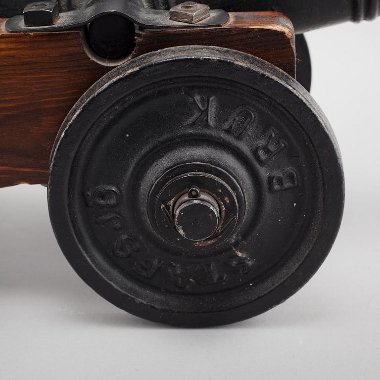 A 20th century salute cannon with wooden gun carriage by Stafsjö Bruk, Sweden.