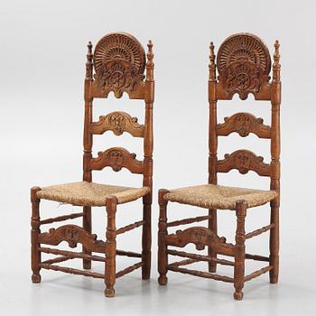 A pair of Spanish colonial style ladder-back chairs, circa 1900.