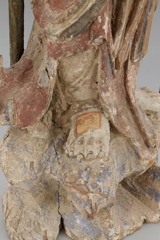 A wooden sculpture of Guanyin, Ming dynasty (1368-1644).