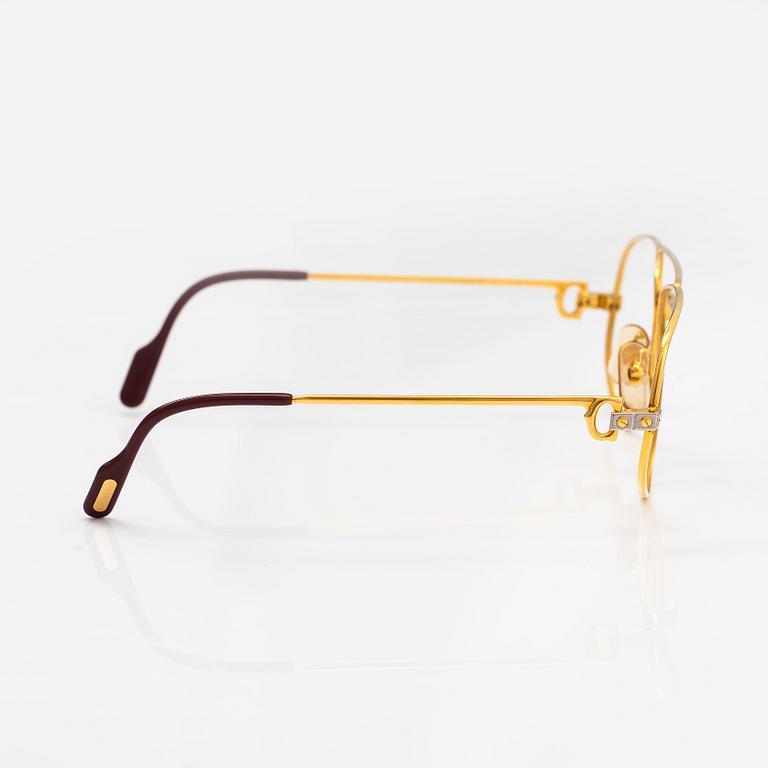 must de Cartier, Santos, a pair of eyeglass frames. Marked Cartier, Paris, Made in France 135, 56, 16.