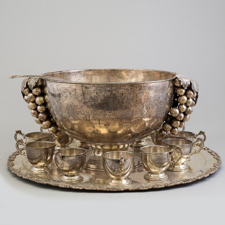 A first half of the 20th century silver punch bowl with twelve cups.