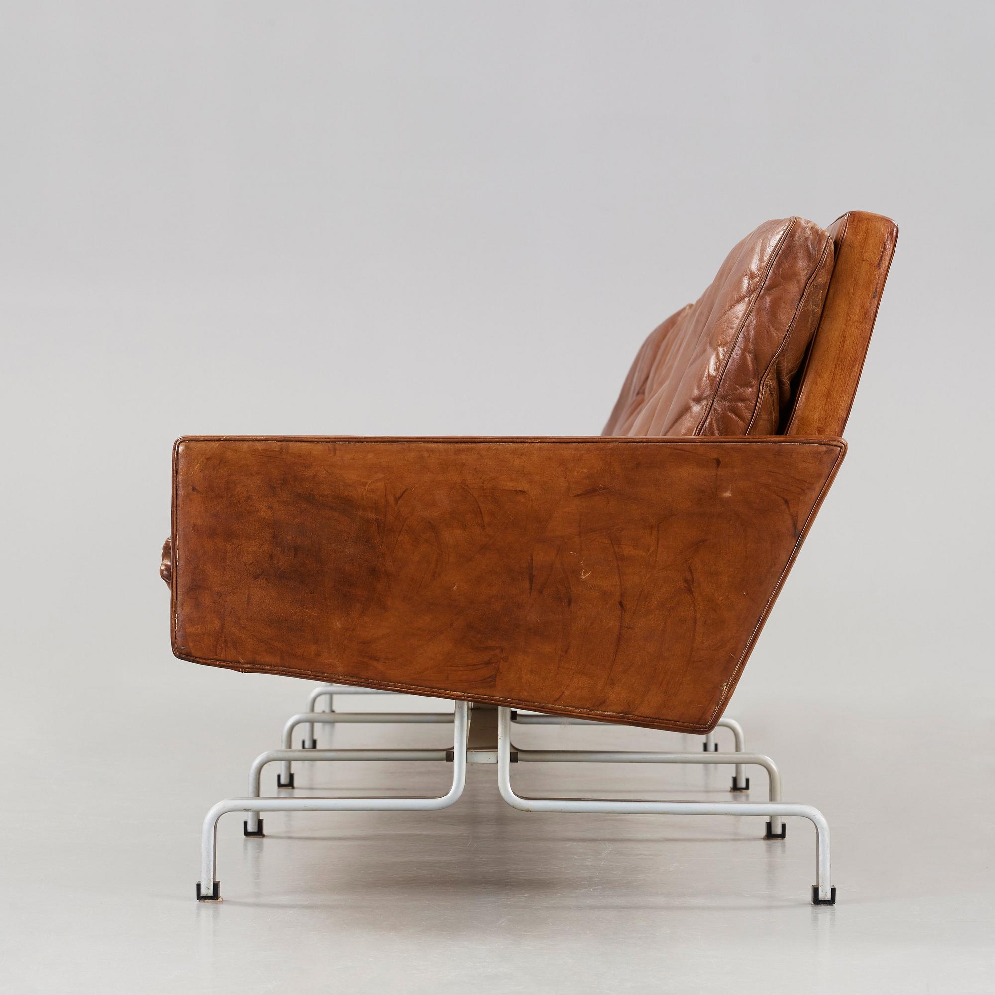 Poul Kjaerholm, a 'PK-31-4' four-seated brown leather and steel sofa, E Kold Christensen, Denmark 1960's.