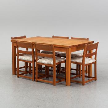 Six chairs by Carl Malmsten and a table by an unknown maker.