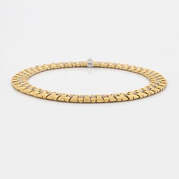 An 18K gold necklace set with round brilliant-cut diamonds.