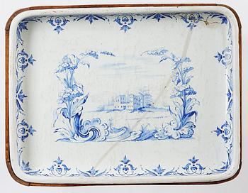 A rococo faience-top tea table, Rörstrand 1760.