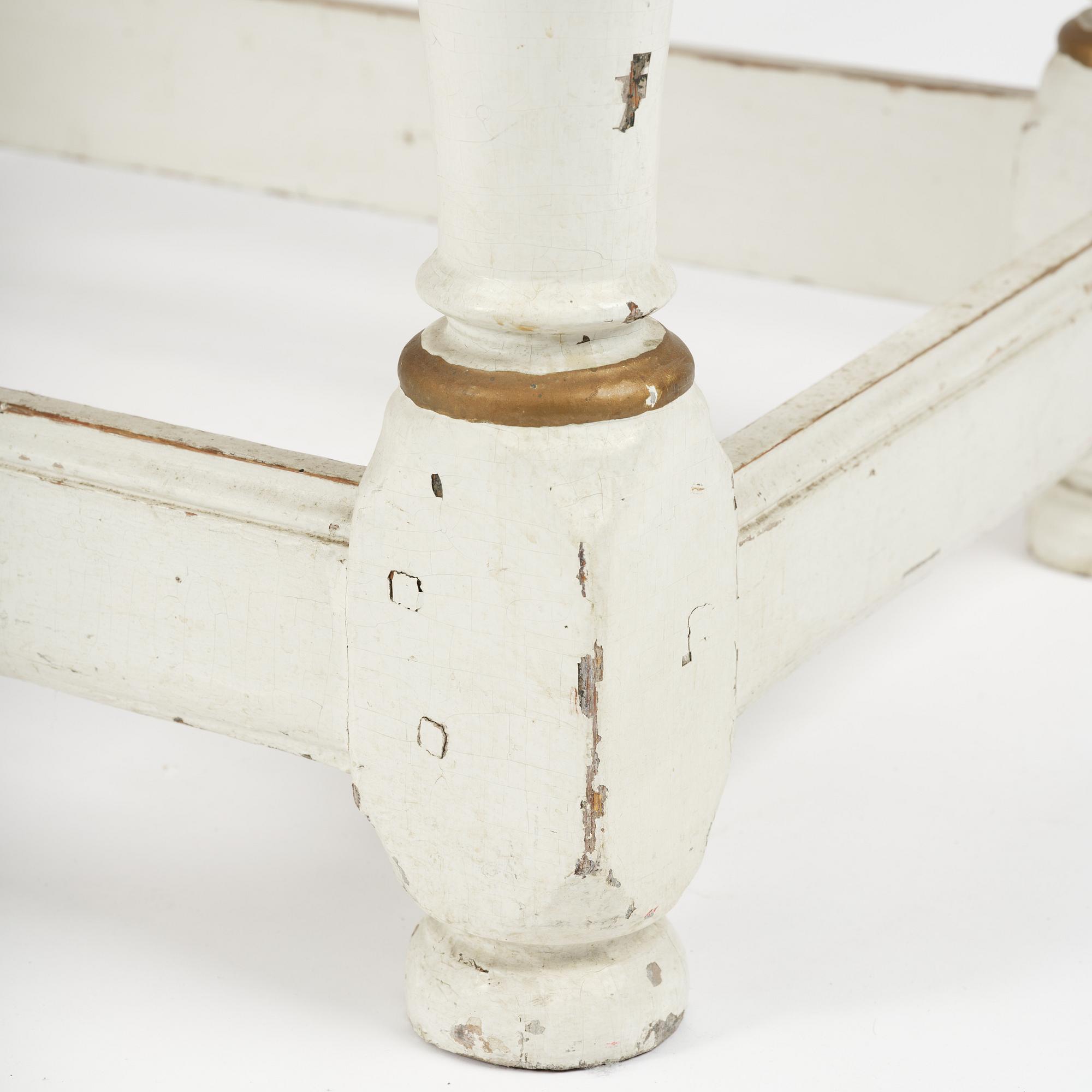 A Swedish baroque and faux marble-painted table, circa 1700.