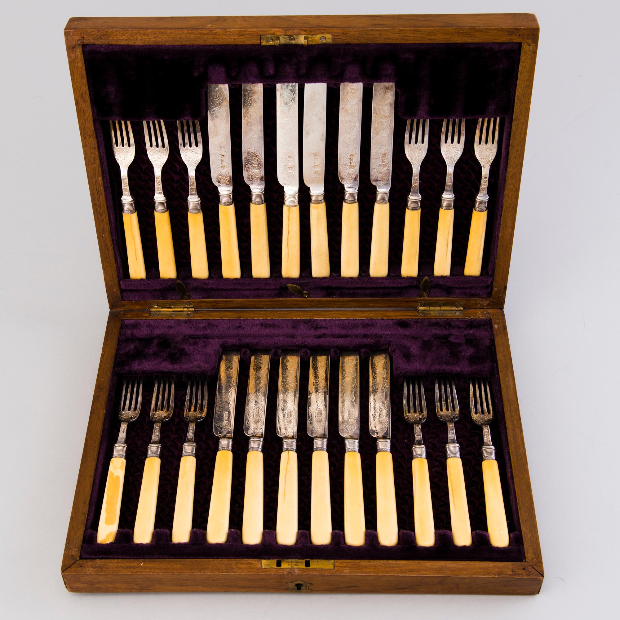 CUTLERY, 12+12, silver with bone handles, Sheffield 1894.