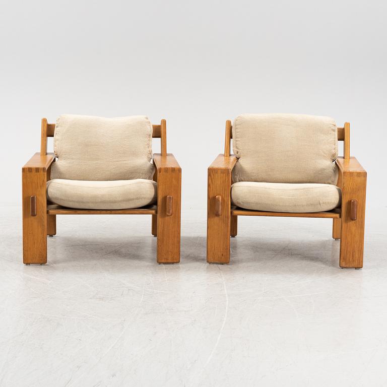 Esko Pajamies, a pair of oak 'Bonanza' lounge chairs from Asko, 1970's.