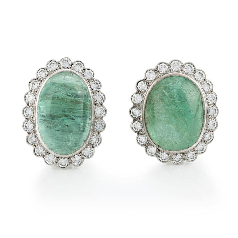 A pair of 18K white gold earrings with cabochon-cut emeralds.