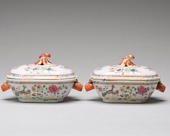 A pair of famille rose 'double peacock' butter tureens with covers and stands, Qing dynasty, Qianlong (1736-95).