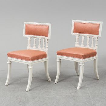 A gustavian style table and six chairs. First half of the 20th century.