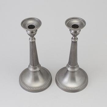 a pair of pewter candle sticks by B O Santesson Stockholm 1983.