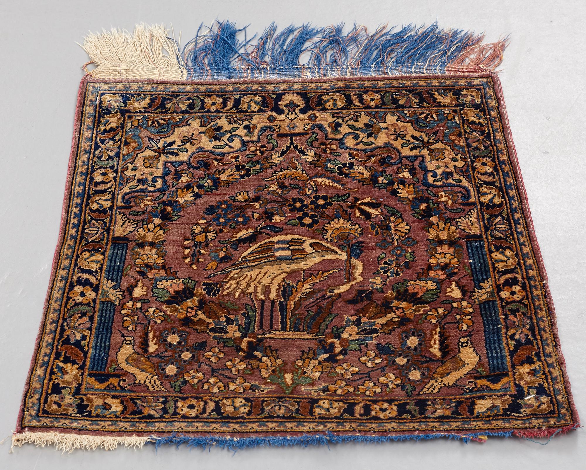 MATTO, a semi-antique silk Kashan possibly Motachem, ca 51-52,5 x 48.5-51 cm.