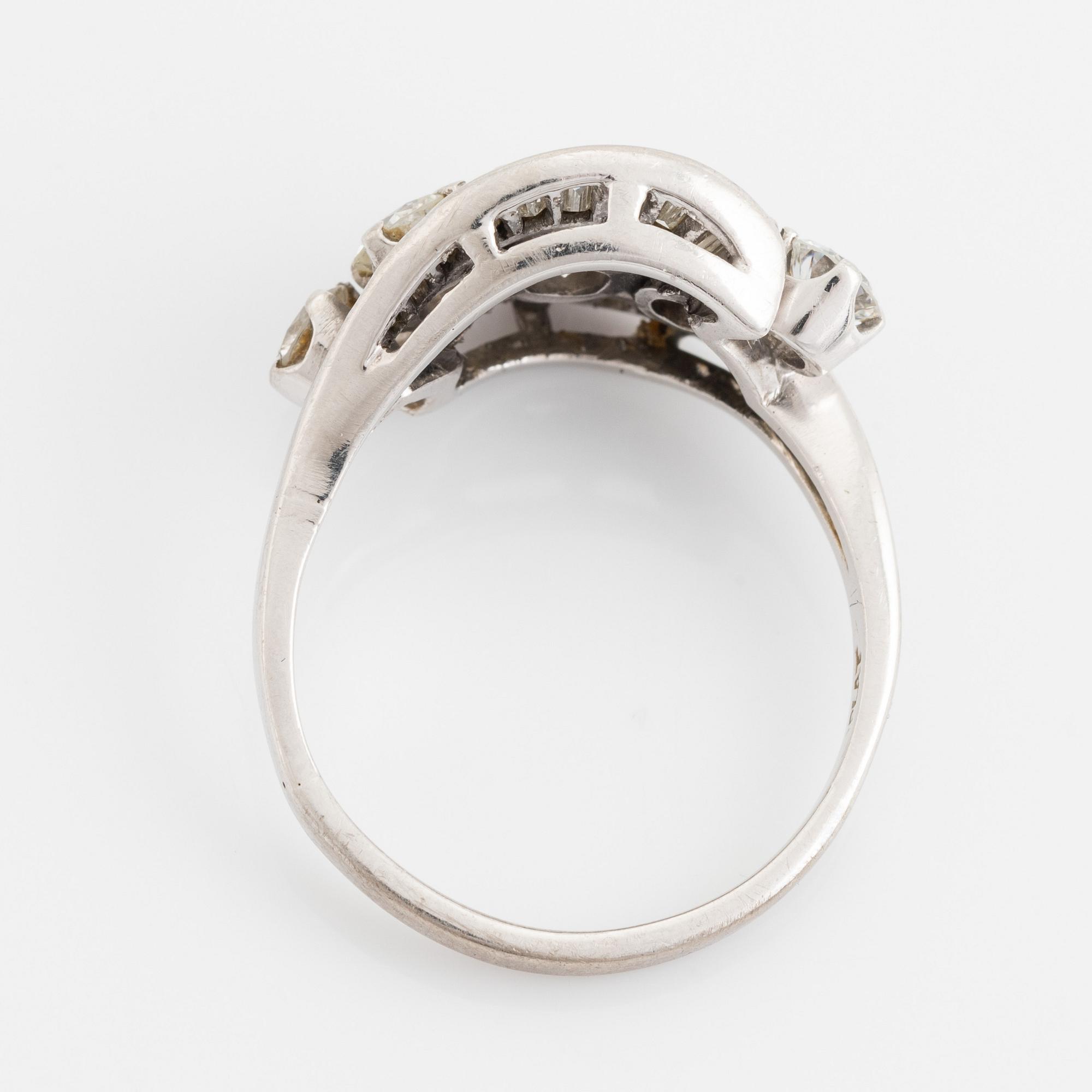 Platinum, brilliant and baguette cut diamond ring.