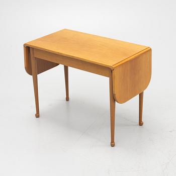 Josef Frank, a model 1007 mahogany drop leaf table, Svenskt Tenn, Sweden, second part of the 20th Century.