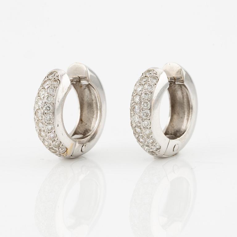 A pair of earrings in 18K white gold with round brilliant-cut diamonds.