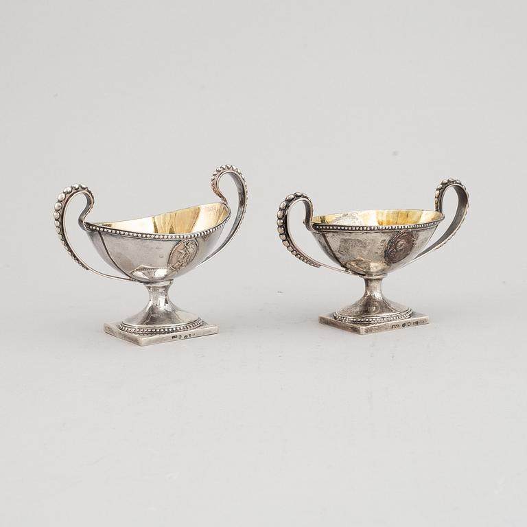 A matched pair of Swedish parcel-gilt silver salt-cellars, mark of A Floberg and PA Sjöberg, Stockholm 1799 and 1823.