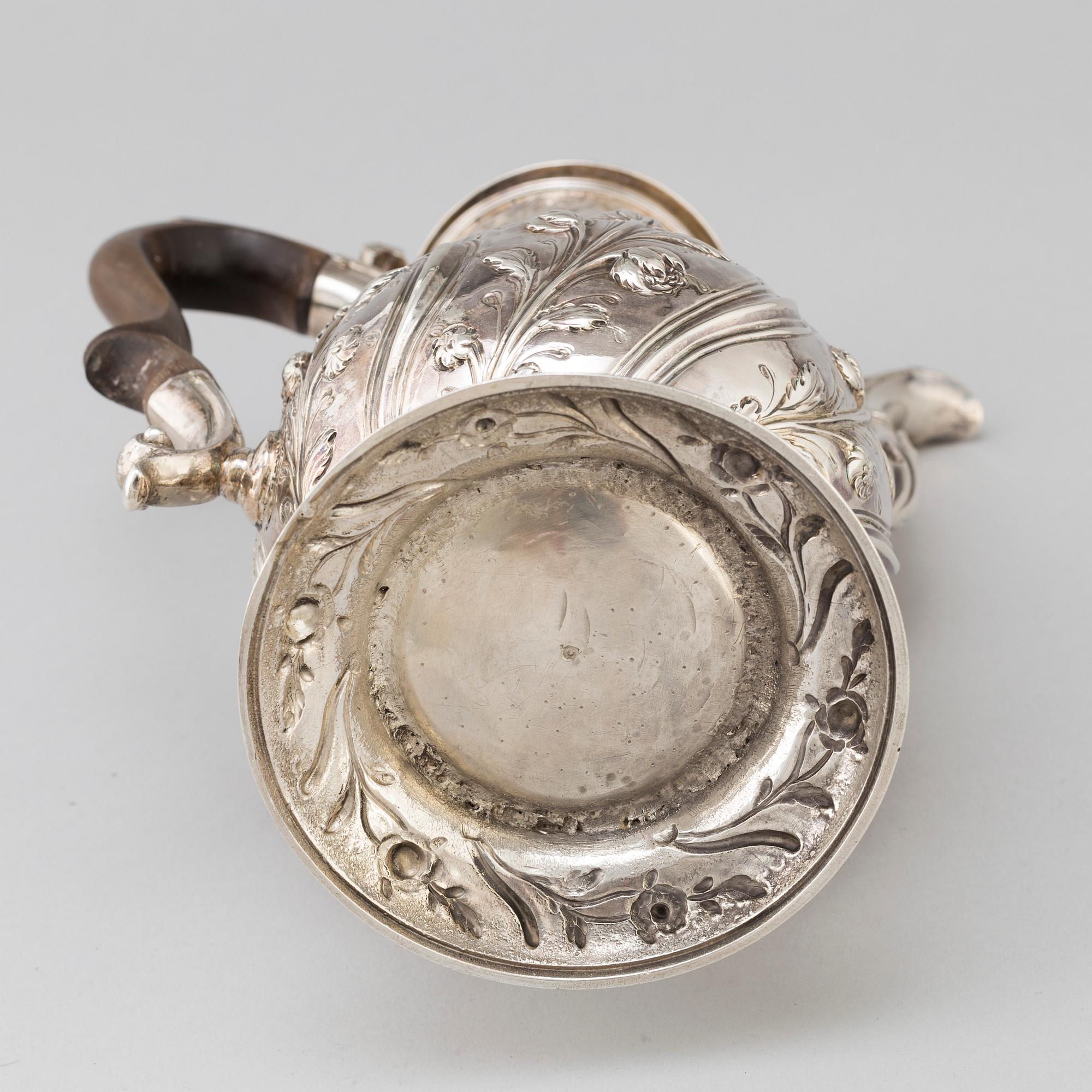 An English 18 th century silver coffee-pot, mark of Benjamin Gignac, London 1763.