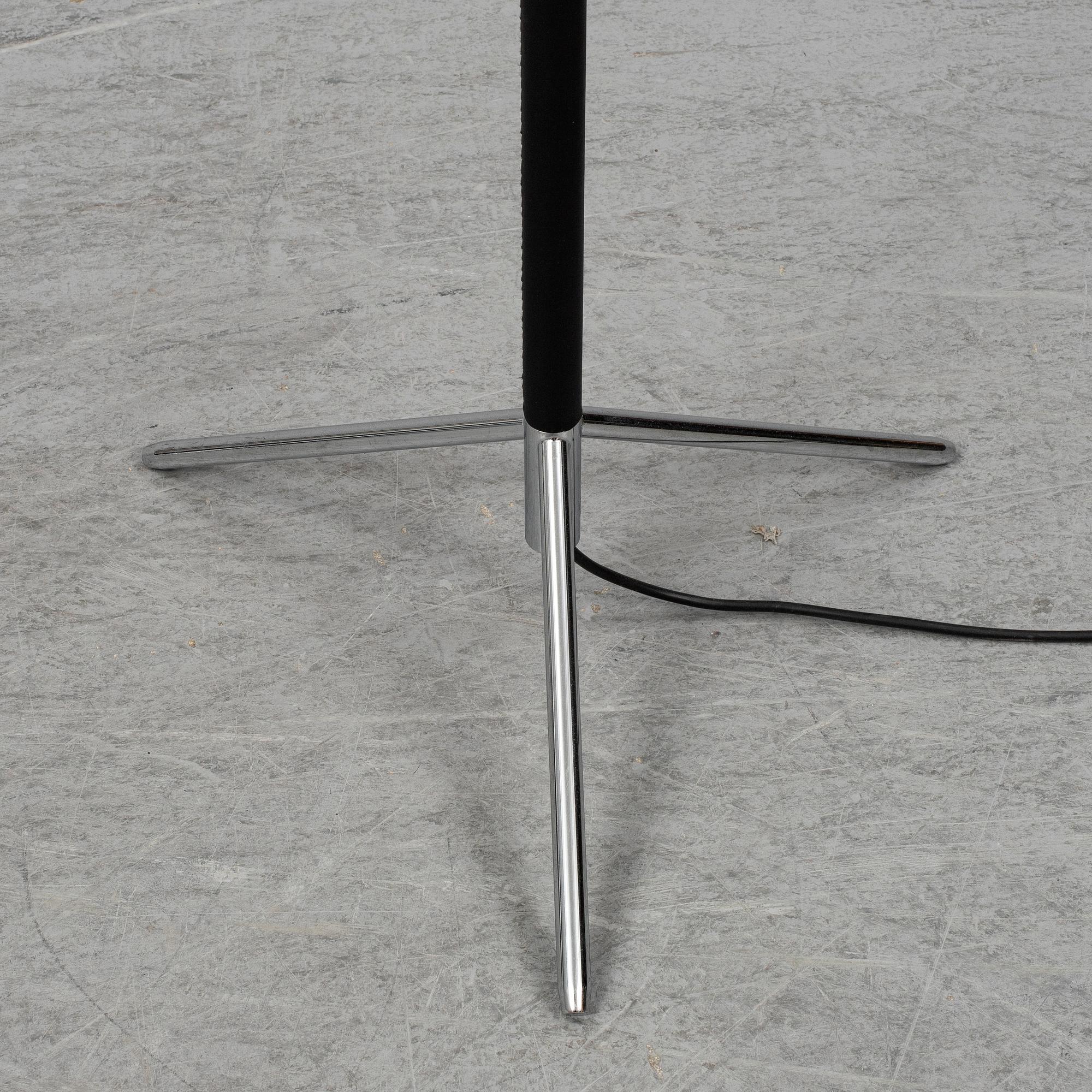 Three contemporary floorlamps by Santa & Cole.