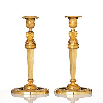 A pair of French Empire candlesticks, early 19th century.