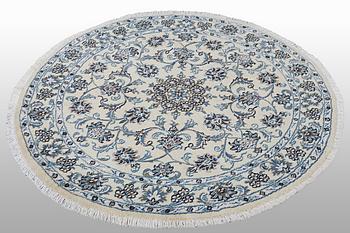 A rug, Nain, part silk, ca 316 x 136 cm.