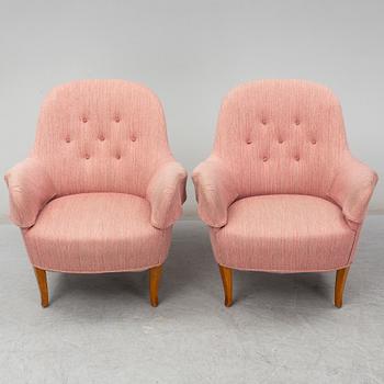 A pair of second half of the 20th Century 'Cirkus' easy chairs by Carl Malmsten.