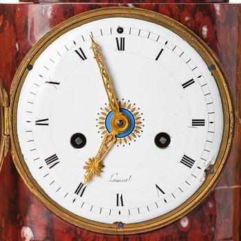 A French Empire 19th century gilt bronze mantel clock signed Lamiral.