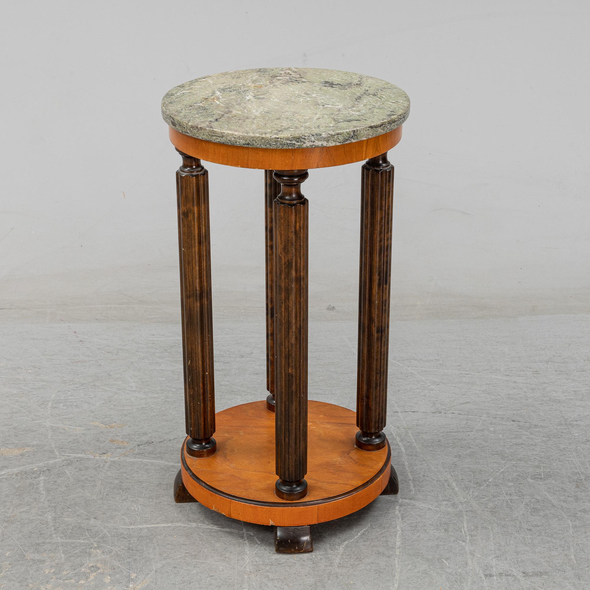 A stone top pedestal, 1920's/30's.