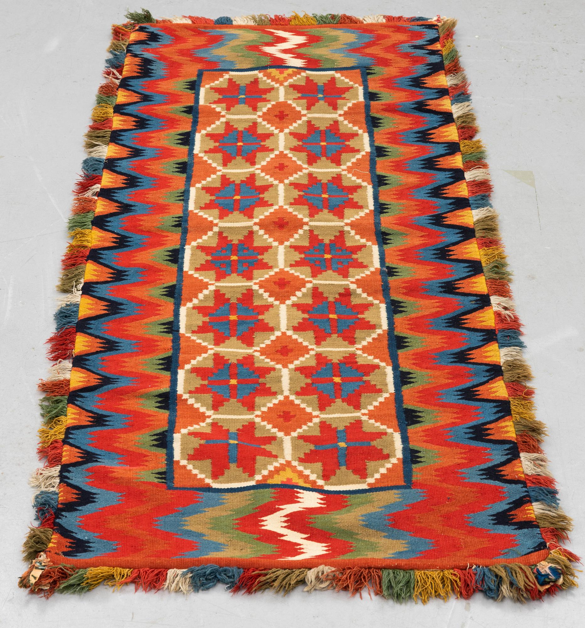 A carriage cushion, double-interlocked tapestry, ca 109,5 x 46 cm, Scania, Sweden.