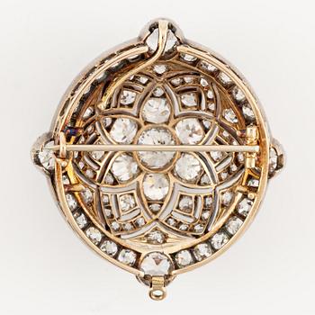 A brooch/pendant in gold with old-cut diamonds.