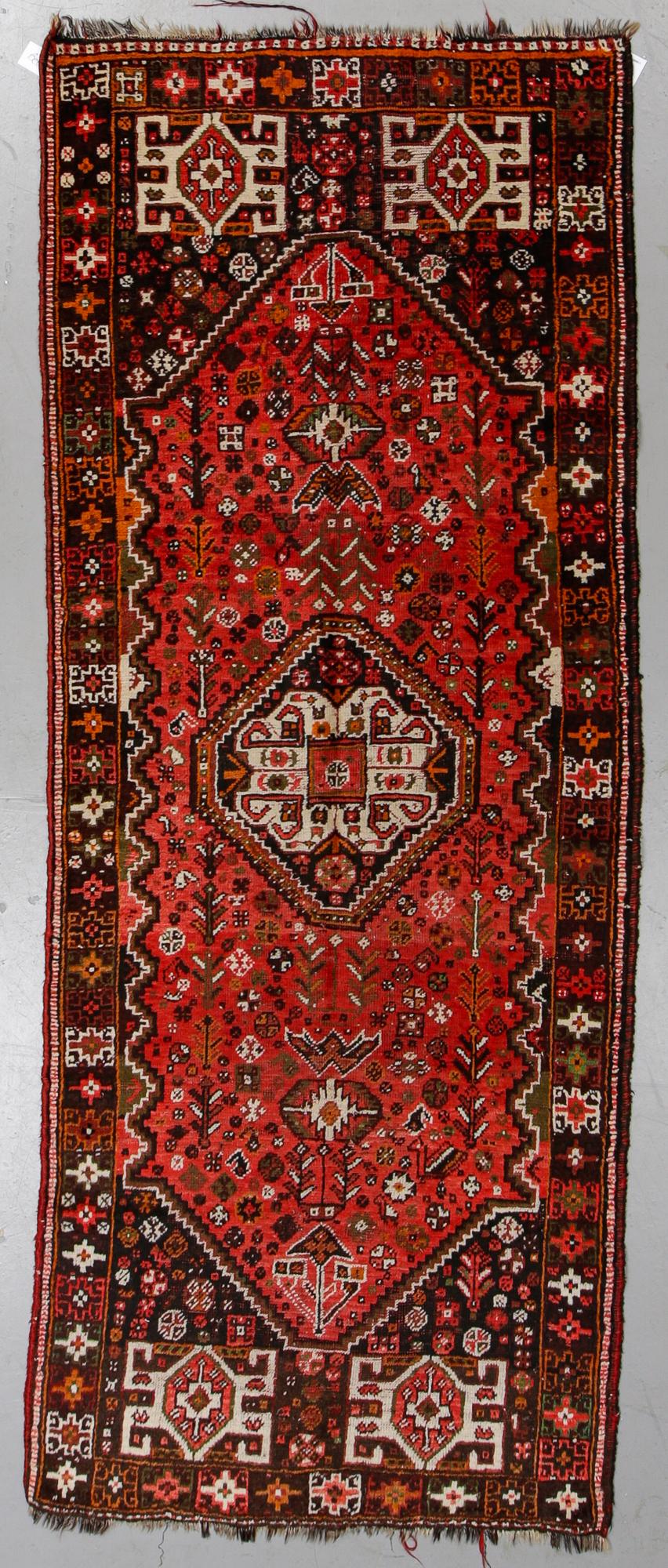 A rug, Shiraz, ca 292 x 115 cm.