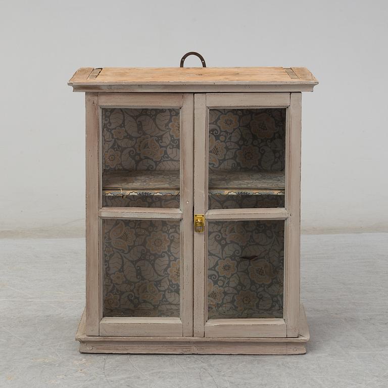a wall-cabinet from the 19th century.