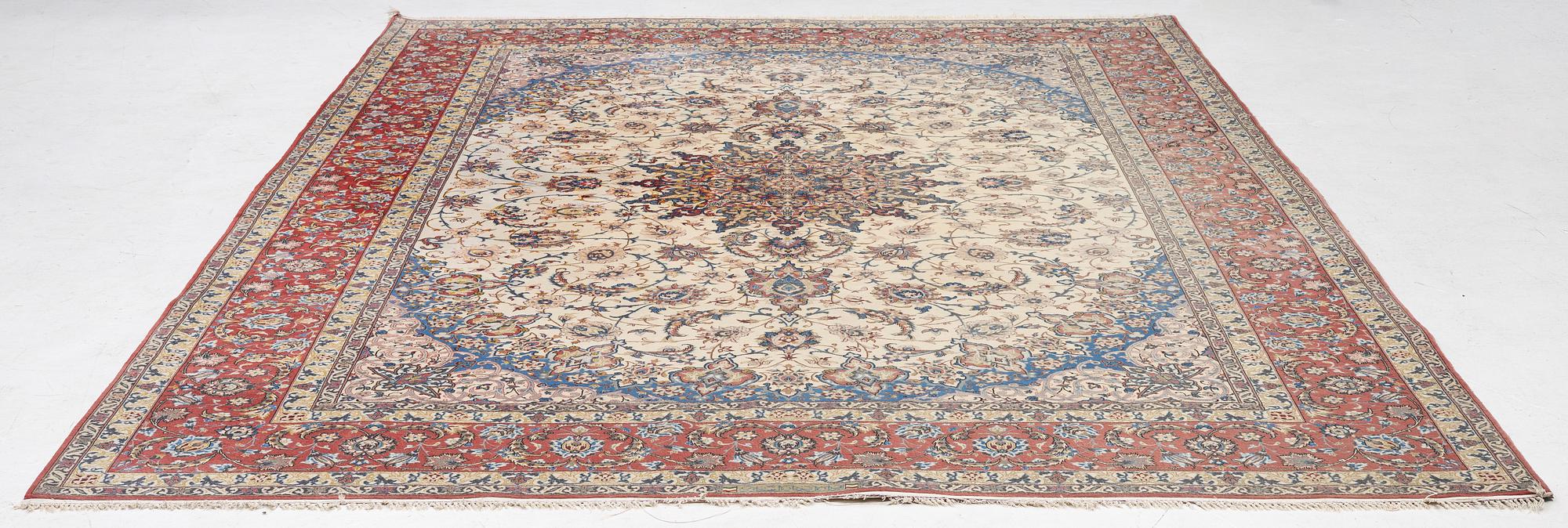 An Isfahan carpet, signed, approx. 372 x 255 cm.
