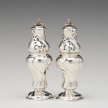 A matched pair of Swedish Rokoko silver sugar-casters, one marked Olof Gravander, Kristinehamn 1764, one a later copie.