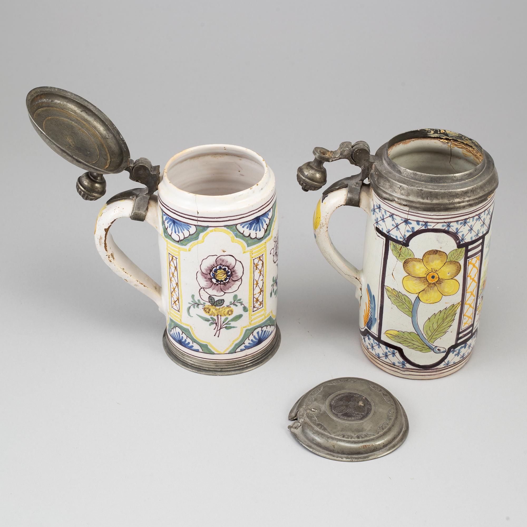 Two pewter mounted faience tankards, Germany, 18th century..