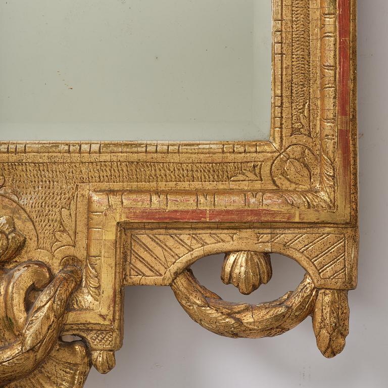 A Trasitional giltwood mirror by J. Åkerblad (master in Stockholm 1758-99).