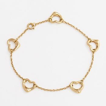Tiffany & Co, Elsa Peretti, an 18K gold 'Open Heart' bracelet.