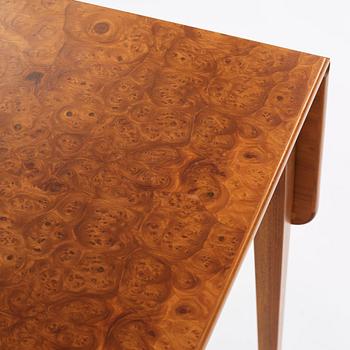 Josef Frank, a mahogany dinner table with burled wood top, Svenskt Tenn Sweden 1940s-50s.