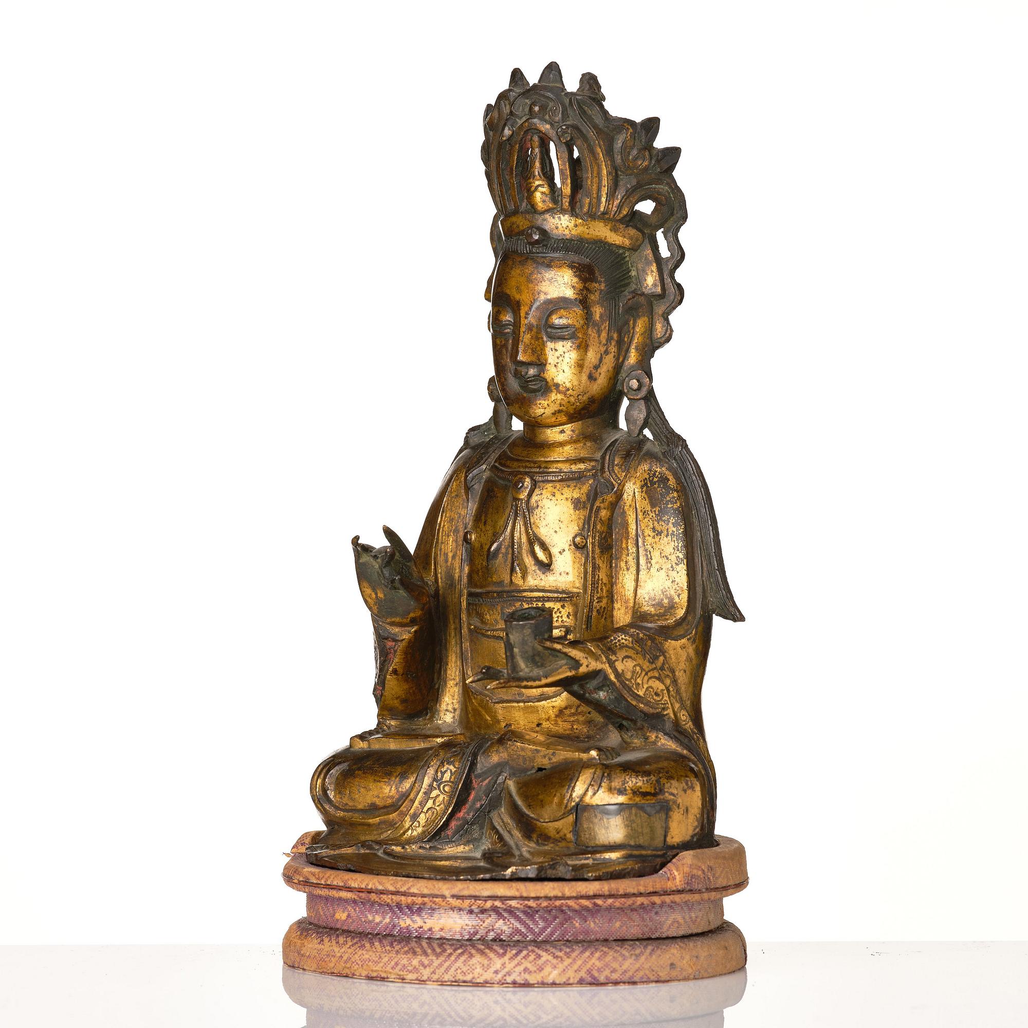A gilt bronze figure of Guanyin, Ming dynasty, 16th/17th Century.