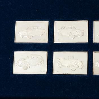 Plaketter, 12 st, silver, "De Historiska Volvobilarna 1927-1977", Franklin Mint.